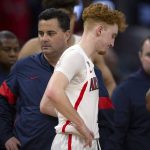 Arizona coach Sean Miller, left, and guard Nico Mannion react at the end of the team's NCAA college basketball game against St. John's on Saturday, Dec. 21, 2019, in San Francisco. St. John's won 70-67. (AP Photo/D. Ross Cameron)