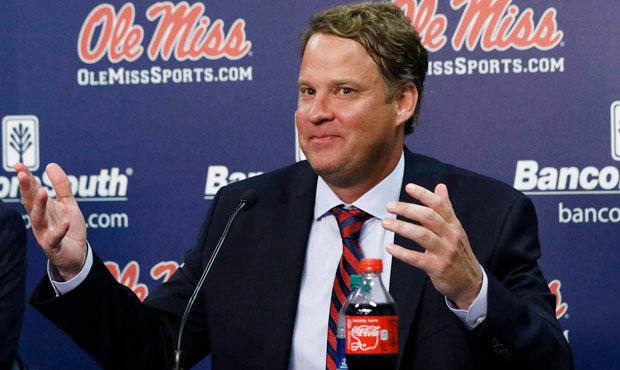Lane Kiffin responds to reporters questions at a news conference, after being introduced to Mississ...