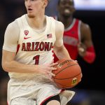 Arizona guard Nico Mannion (1) looks to pass the ball during the first half of the team's NCAA college basketball game against St. John's on Saturday, Dec. 21, 2019, in San Francisco. (AP Photo/D. Ross Cameron)