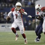 Arizona Cardinals quarterback Brett Hundley (7) keeps the ball during the second half of an NFL football game against the Seattle Seahawks, Sunday, Dec. 22, 2019, in Seattle. (AP Photo/Elaine Thompson)