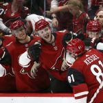 Arizona Coyotes right wing Phil Kessel (81) celebrates his goal against the Minnesota Wild with Derek Stepan, left, Michael Grabner, second from left, and Christian Fischer (36) during the first period of an NHL hockey game Thursday, Dec. 19, 2019, in Glendale, Ariz. (AP Photo/Ross D. Franklin)