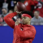 Ohio State quarterback Justin Fields warms up for the team's Fiesta Bowl NCAA college football playoff semifinal against Clemson on Saturday, Dec. 28, 2019, in Glendale, Ariz. (AP Photo/Rick Scuteri).
