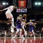 Phoenix Suns' Kelly Oubre Jr. (3) shoots as Houston Rockets' Ben McLemore (16) defends during the first half of an NBA basketball game Saturday, Dec. 7, 2019, in Houston. (AP Photo/David J. Phillip)