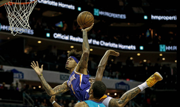 Phoenix Suns forward Kelly Oubre Jr. (3) shoots over Charlotte Hornets forward Miles Bridges in the...