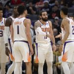Phoenix Suns guard Ricky Rubio, second from right, talks with teammate Elie Okobo, right, during the first quarter of an NBA basketball game against the Sacramento Kings in Sacramento, Calif., Saturday, Dec. 28, 2019. (AP Photo/Hector Amezcua)