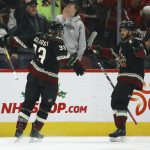 
              Arizona Coyotes defenseman Alex Goligoski (33) celebrates his goal against the New Jersey Devils with Coyotes right wing Vinnie Hinostroza, right, during the first period of an NHL hockey game, Saturday, Dec. 14, 2019, in Glendale, Ariz. (AP Photo/Ross D. Franklin)
            