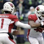 Arizona Cardinals quarterback Kyler Murray (1) hands off to running back Kenyan Drake, right, for an 80-yard touchdown run during the first half of an NFL football game against the Seattle Seahawks, Sunday, Dec. 22, 2019, in Seattle. (AP Photo/Elaine Thompson)