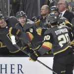 Vegas Golden Knights center Chandler Stephenson (20) celebrates with the bench after scoring against the Arizona Coyotes during the second period of an NHL hockey game Saturday, Dec. 28, 2019, in Las Vegas. (AP Photo/David Becker)