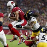 Arizona Cardinals wide receiver Larry Fitzgerald (11) runs as Pittsburgh Steelers outside linebacker Bud Dupree (48) makes the hit during the first half of an NFL football game, Sunday, Dec. 8, 2019, in Glendale, Ariz. (AP Photo/Rick Scuteri)