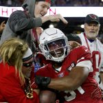 Arizona Cardinals running back David Johnson (31) celebrates his touchdown catch against the Pittsburgh Steelers with fans during the second half of an NFL football game, Sunday, Dec. 8, 2019, in Glendale, Ariz. (AP Photo/Ross D. Franklin)