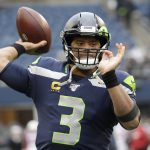Seattle Seahawks quarterback Russell Wilson passes during warmups before an NFL football game against the Arizona Cardinals, Sunday, Dec. 22, 2019, in Seattle. (AP Photo/Elaine Thompson)