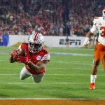 Ohio State running back J.K. Dobbins fails to hang on to a pass as he crosses the goal line, as Clemson defensive end Justin Foster watches during the first half of the Fiesta Bowl NCAA college football playoff semifinal Saturday, Dec. 28, 2019, in Glendale, Ariz. Dobbins did not score on the play. (AP Photo/Ross D. Franklin)