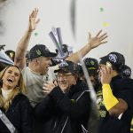 Oregon coach Mario Cristobal raises his hand during the celebration after Oregon defeated Utah 37-15 in and NCAA college football game for the Pac-12 Conference championship, in Santa Clara, Calif., Friday, Dec. 6, 2018. (AP Photo/Tony Avelar)