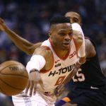 Houston Rockets guard Russell Westbrook (0) loses the ball as Phoenix Suns forward Mikal Bridges, right, defends during the first half of an NBA basketball game Saturday, Dec. 21, 2019, in Phoenix. (AP Photo/Ross D. Franklin)