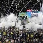 Oregon players celebrate after defeating Utah 37-15 in the Pac-12 Conference championship NCAA college football game in Santa Clara, Calif., Friday, Dec. 6, 2018. (AP Photo/Tony Avelar)