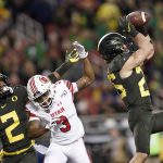 Oregon safety Brady Breeze, right, intercepts a pass intended for Utah wide receiver Demari Simpkins (3) as Oregon cornerback Mykael Wright (2) defends during the first half of the Pac-12 Conference championship NCAA college football game in Santa Clara, Calif., Friday, Dec. 6, 2018. (AP Photo/Tony Avelar)