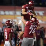 Washington State wide receiver Brandon Arconado (19) celebrates with Renard Bell (9) and Robert Valencia (74) after scoring a touchdown against Air Force in the second half during the Cheez-It Bowl NCAA college football game, Friday, Dec. 27, 2019, in Phoenix. Air Force defeated Washington State 31-21. (AP Photo/Rick Scuteri)