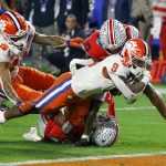 Clemson running back Travis Etienne scores against Ohio State during the second half of the Fiesta Bowl NCAA college football playoff semifinal Saturday, Dec. 28, 2019, in Glendale, Ariz. (AP Photo/Ross D. Franklin)