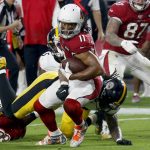 Arizona Cardinals wide receiver Larry Fitzgerald (11) is hit by Pittsburgh Steelers outside linebacker Bud Dupree during the first half of an NFL football game, Sunday, Dec. 8, 2019, in Glendale, Ariz. (AP Photo/Ross D. Franklin)