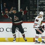 Arizona Coyotes left wing Michael Grabner celebrates his goal as Chicago Blackhawks right wing Patrick Kane (88) skates past during the first period of an NHL hockey game Thursday, Dec. 12, 2019, in Glendale, Ariz. (AP Photo/Ross D. Franklin)