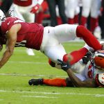 Arizona Cardinals wide receiver Larry Fitzgerald is tackled by Cleveland Browns defensive back T.J. Carrie (38) during the first half of an NFL football game, Sunday, Dec. 15, 2019, in Glendale, Ariz. (AP Photo/Rick Scuteri)