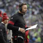 Arizona Cardinals head coach Kliff Kingsbury wears a headset on the sideline during the first half of an NFL football game against the Seattle Seahawks, Sunday, Dec. 22, 2019, in Seattle. (AP Photo/Lindsey Wasson)