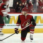 Arizona Coyotes left wing Taylor Hall warms up with teammates prior to an NHL hockey game against the Minnesota Wild on Thursday, Dec. 19, 2019, in Glendale, Ariz. Hall was acquired in a trade with the New Jersey Devils. (AP Photo/Ross D. Franklin)
