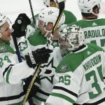 Dallas Stars goaltender Anton Khudobin (35) celebrates a win against the Arizona Coyotes with Stars left wing Roope Hintz (24), defenseman Esa Lindell (23) and right wing Alexander Radulov (47) as time expires in an NHL hockey game, Sunday, Dec. 29, 2019, in Glendale, Ariz. The Stars defeated the Coyotes 4-2. (AP Photo/Ross D. Franklin)