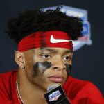 Ohio State quarterback Justin Fields speaks during a news conference after the team's 29-23 loss to Clemson in the Fiesta Bowl NCAA college football playoff semifinal Saturday, Dec. 28, 2019, in Glendale, Ariz. (AP Photo/Ross D. Franklin)