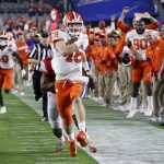 Clemson quarterback Trevor Lawrence runs for a touchdown against Ohio State during the first half of the Fiesta Bowl NCAA college football playoff semifinal Saturday, Dec. 28, 2019, in Glendale, Ariz. (AP Photo/Ross D. Franklin)