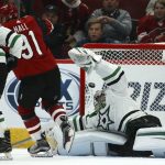 Arizona Coyotes left wing Taylor Hall (91) scores a goal against Dallas Stars goaltender Anton Khudobin, right, as Stars right wing Denis Gurianov (34) looks on during the first period of an NHL hockey game Sunday, Dec. 29, 2019, in Glendale, Ariz. (AP Photo/Ross D. Franklin)