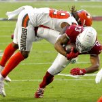 Arizona Cardinals wide receiver Christian Kirk (13) is hit by Cleveland Browns defensive back Sheldrick Redwine during the first half of an NFL football game, Sunday, Dec. 15, 2019, in Glendale, Ariz. (AP Photo/Ross D. Franklin)