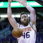 Phoenix Suns center Aron Baynes dunks against the Denver Nuggets in the second half during an NBA basketball game, Monday, Dec. 23, 2019, in Phoenix. The Nuggets defeated the Suns 113-111. (AP Photo/Rick Scuteri)