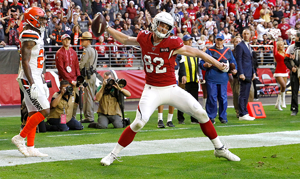 Tight end Dan Arnold #82 of the Arizona Cardinals spikes the ball in celebration after scoring a to...