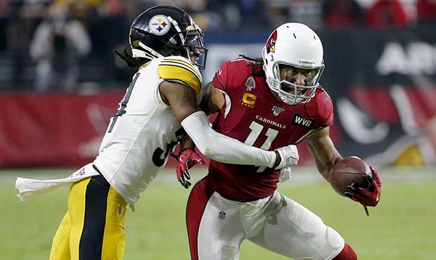 Arizona Cardinals wide receiver Larry Fitzgerald (11) is hit by Pittsburgh Steelers strong safety T...