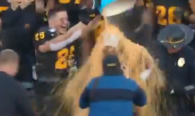 Herm Edwards receives Frosted Flakes bath after Sun Bowl win