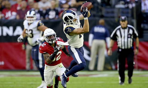 Los Angeles Rams wide receiver Cooper Kupp pulls in a catch as Arizona Cardinals strong safety Budd...