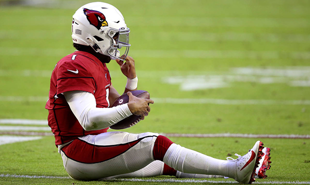 Arizona Cardinals quarterback Kyler Murray sits on the turf after a sack during the first half of a...