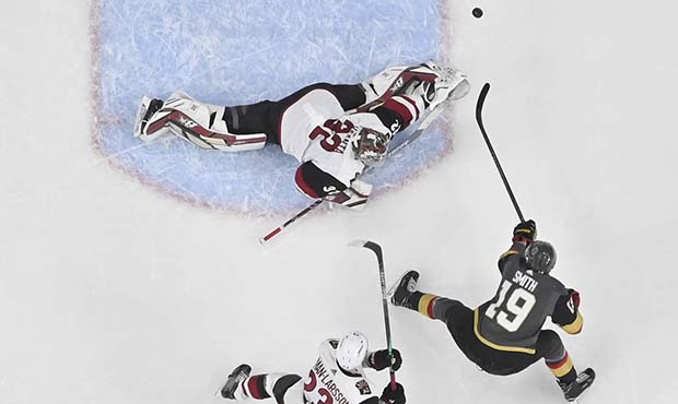 Vegas Golden Knights right wing Reilly Smith (19) shoots against Arizona Coyotes goaltender Antti R...
