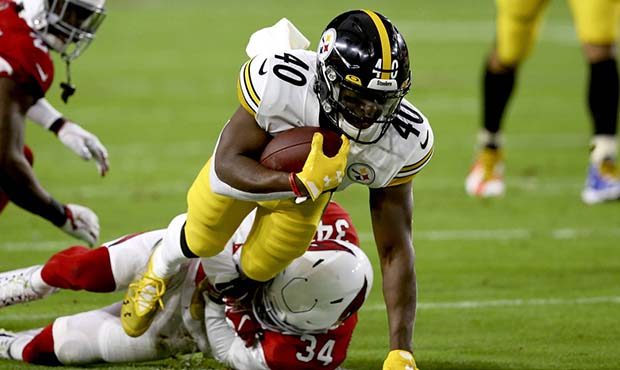 Pittsburgh Steelers running back Kerrith Whyte (40) is tackled by Arizona Cardinals strong safety J...