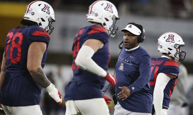 Arizona coach Kevin Sumlin greets his team's defense as they play Arizona State during the second h...