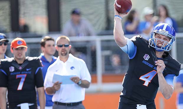 Boise State offensive coordinator Zak Hill looks on as Quarterback Brett Rypien warms up prior to t...