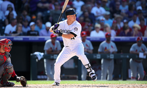 Pat Valaika #4 of the Colorado Rockies bats during the game against the St. Louis Cardinals at Coor...
