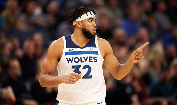 Karl-Anthony Towns #32 of the Minnesota Timberwolves looks on during the home opener against the Mi...