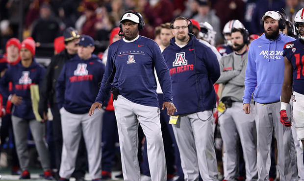 Head coach Kevin Sumlin of the Arizona Wildcats watches from the sidelines during the second half o...