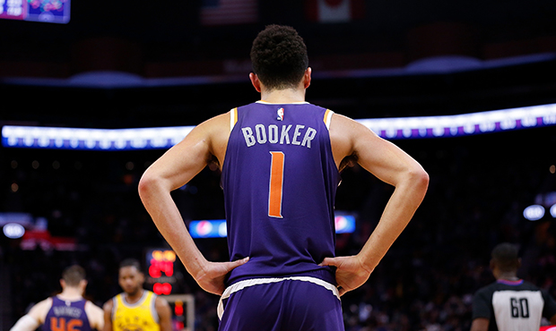 Devin Booker #1 of the Phoenix Suns looks on in the second half against the Golden State Warriors a...