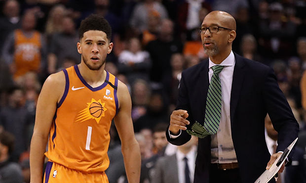 Head coach Monty Williams of the Phoenix Suns talks with Devin Booker #1 during the second half of ...