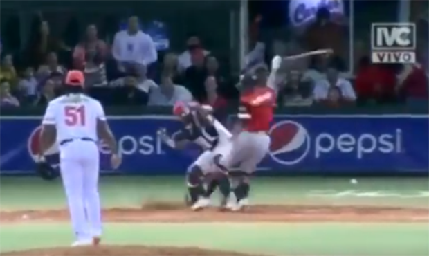 Former D-back swings bat at catcher during Venezuelan League game