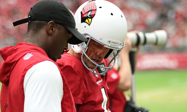 Arizona Cardinals punter Andy Lee looks over the gameplan ahead of the team’s Red and White Pract...