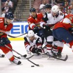 Florida Panthers left wing Jonathan Huberdeau (11) clears the puck from the area during the first period of the team's NHL hockey game against the Arizona Coyotes, Tuesday, Jan. 7, 2020, in Sunrise, Fla. (AP Photo/Wilfredo Lee)